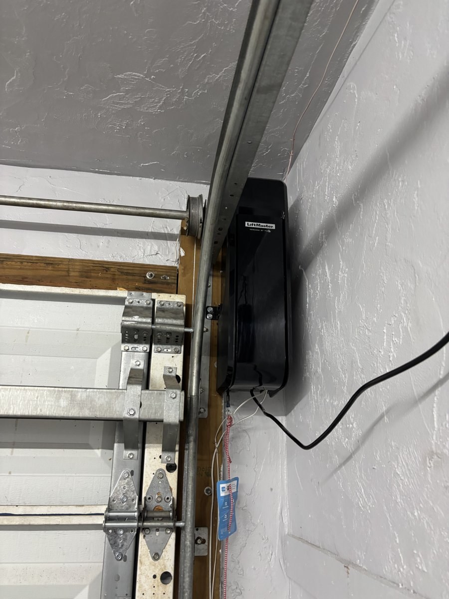 Wall mounted jackshaft opener beside the torsion shaft